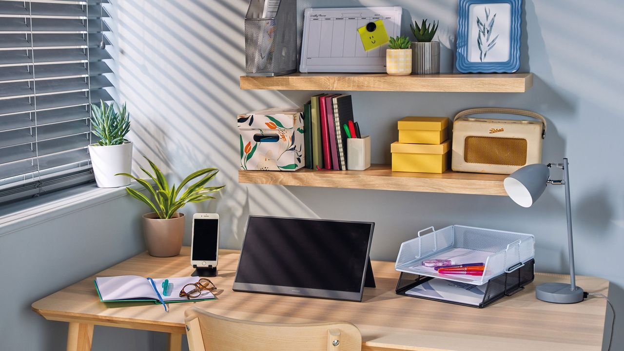 Aldi portable monitor set up on desk with shelves