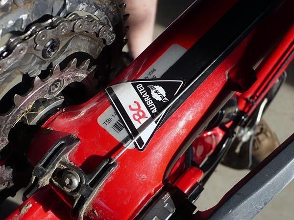 A small sticker under the bottom brackets of the bicycles