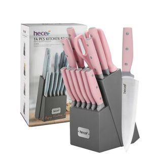 A pink knife set in a gray holder next to a box