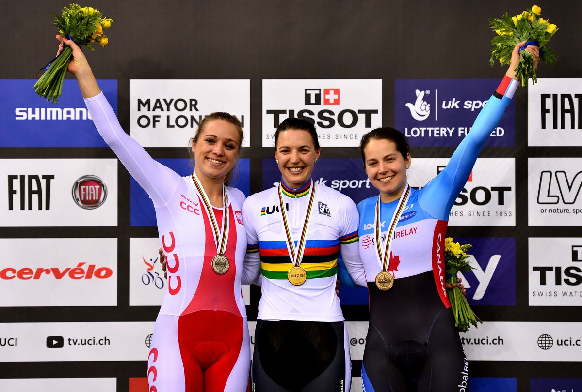 Silver medallist Malgorzata Wojtyra (Poland) and bronze medallist Annie Foreman-Mackey (Canada) flank Rebecca Wiasak (Australia)