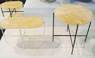 Different shaped tables made from yellow alabaster.