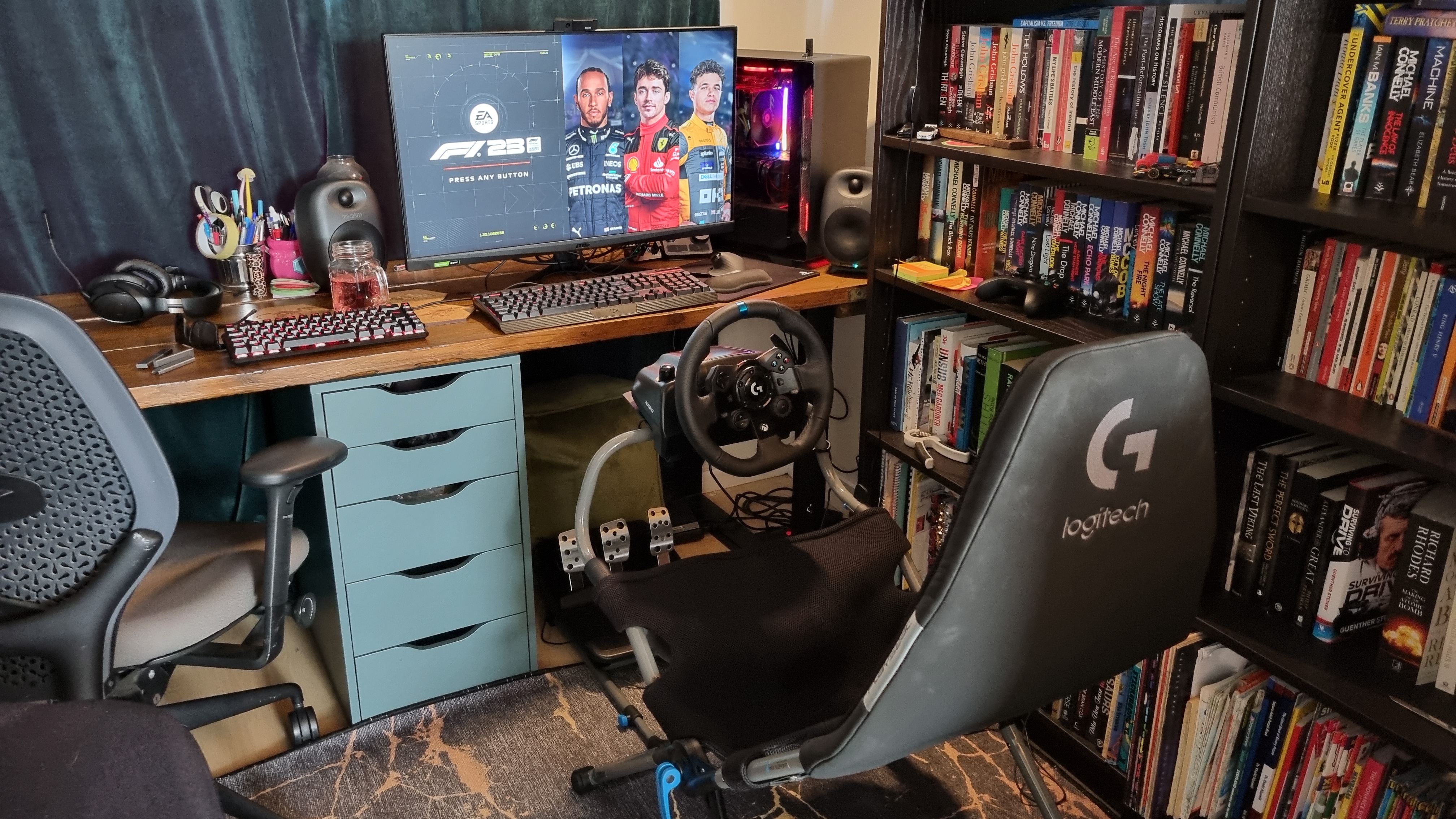 The Logitech Playseat Challenge X set up to play F1 23 with the Logitech G923 racing wheel attached