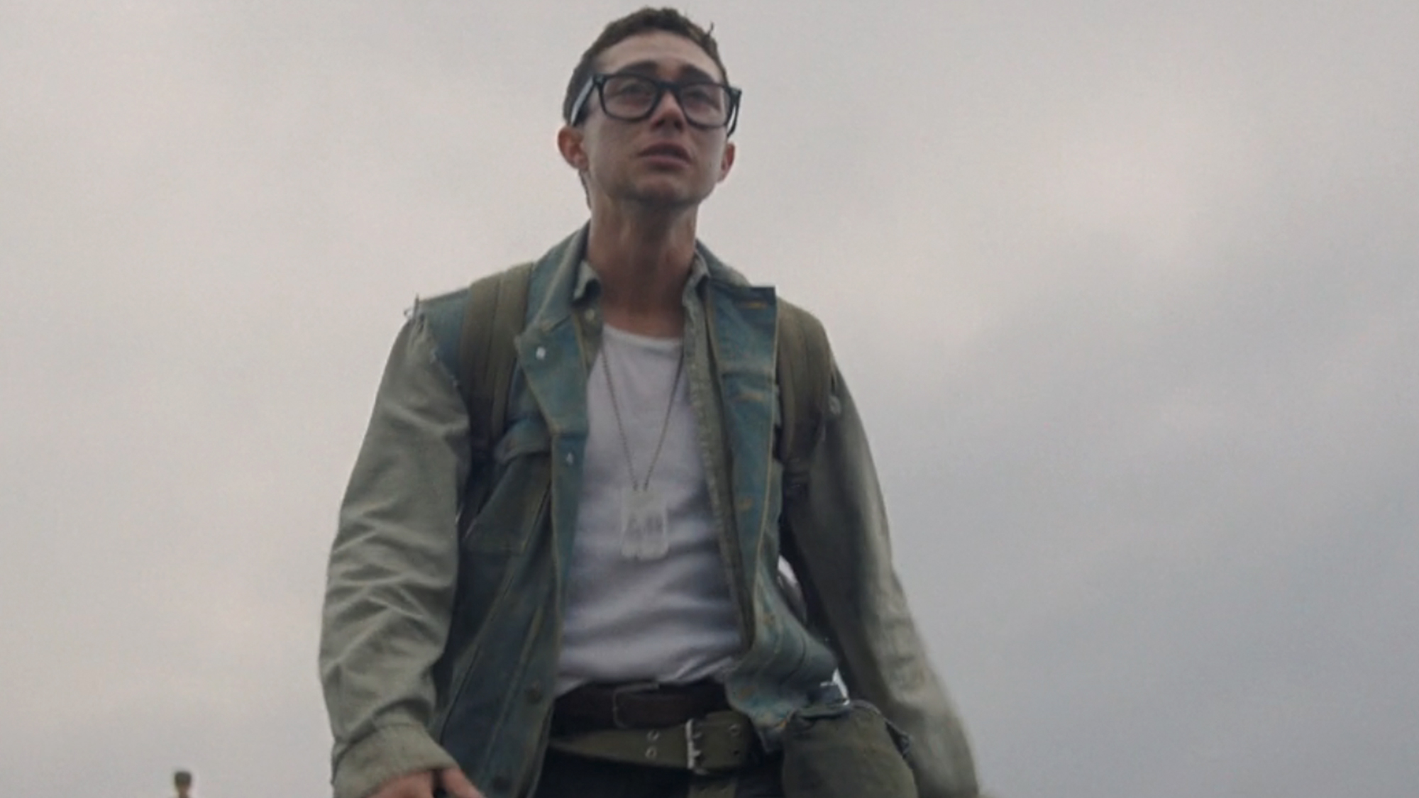 Jordan Gonzalez wearing glasses and looking in pain in The Long Walk