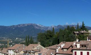 Monte Grappa is seen over the rooftops of Asolo.