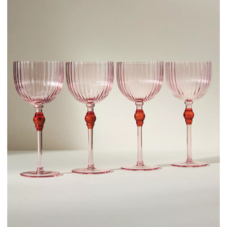 four pink and red wine glasses