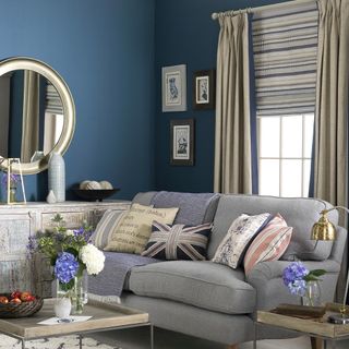 blue living room with neutral curatins