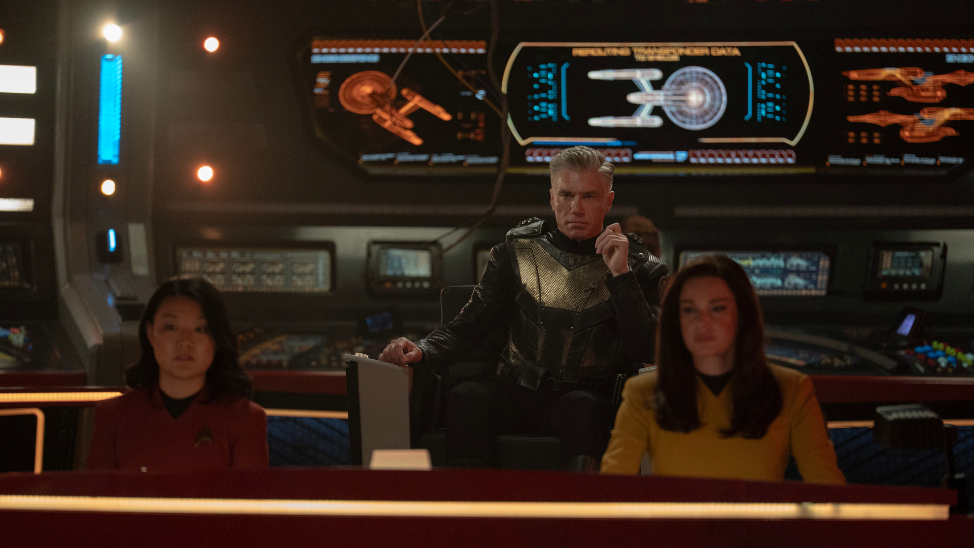 L to R Rong Fu as Mitchell, Rebecca Romijn as Una and Anson Mount as Capt. Pike in season 3 , Episode 1 of Strange New Worlds streaming on Paramount+. Photo Credit: Marni Grossman