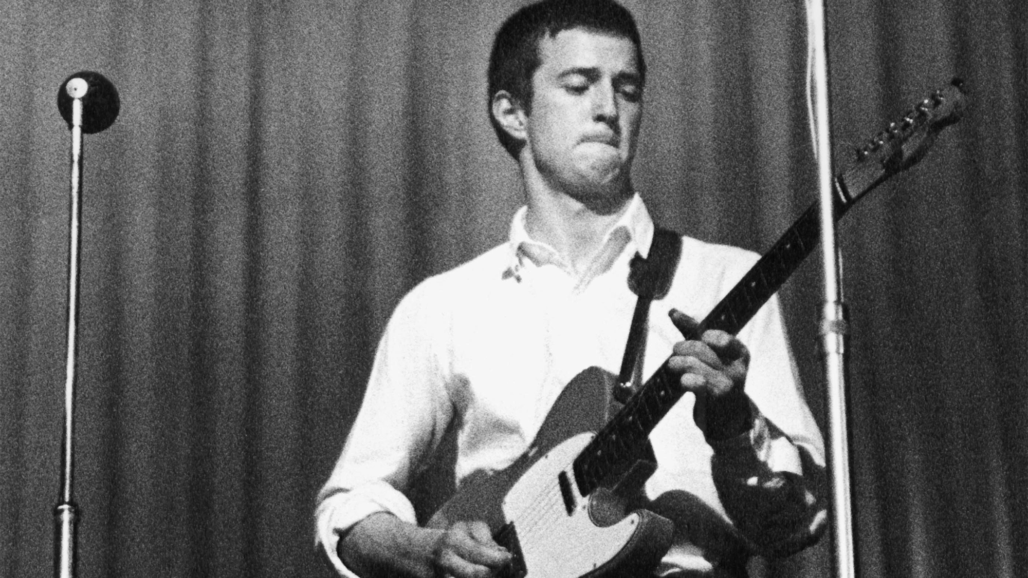 Eric Clapton of The Yardbirds performing live onstage, playing a Fender Telecaster guitar during a concert at The Dome in Brighton on 11th June 1964.