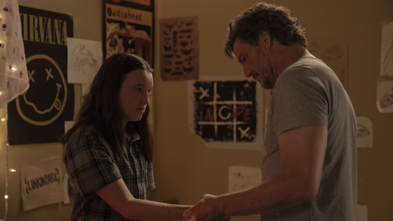 Joel looking at Ellie's new tattoo in her bedroom in The Last of Us Season 2 Ep 6