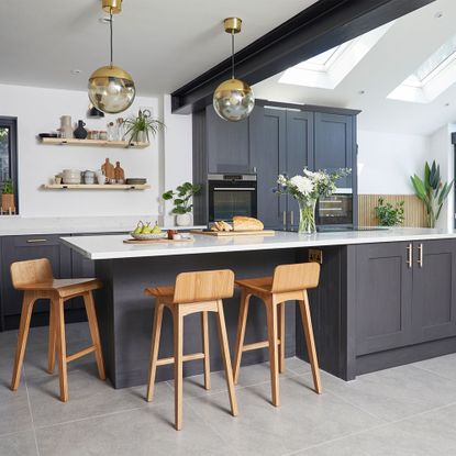 black kitchen with bar stools