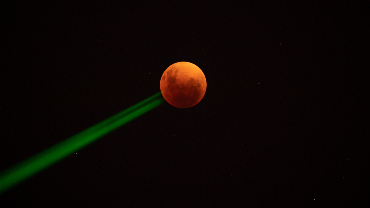 he blood moon is seen during a penumbral lunar eclipse in Santiago, on May 15, 2022.
