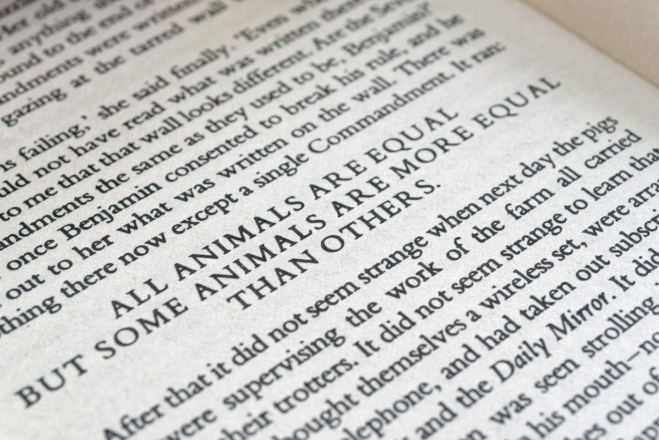 A page of George Orwell Animal Farm, with the famous line &quot; All animals are equal, but some are more equal than others&quot;.