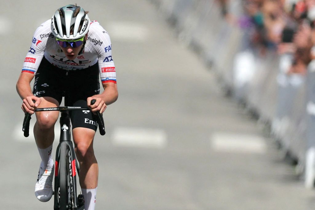 UAE Team Emirates team's Slovenian rider Tadej Pogacar cycles to the finish line to win the 4th stage of the 111th edition of the Tour de France cycling race, 140 km between Pinerolo in Italy, and Valloire in France, on July 2, 2024. (Photo by Thomas SAMSON / AFP)
