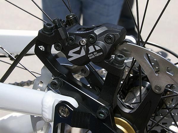 Quad pistons utilize different piston diameters for better modulation.