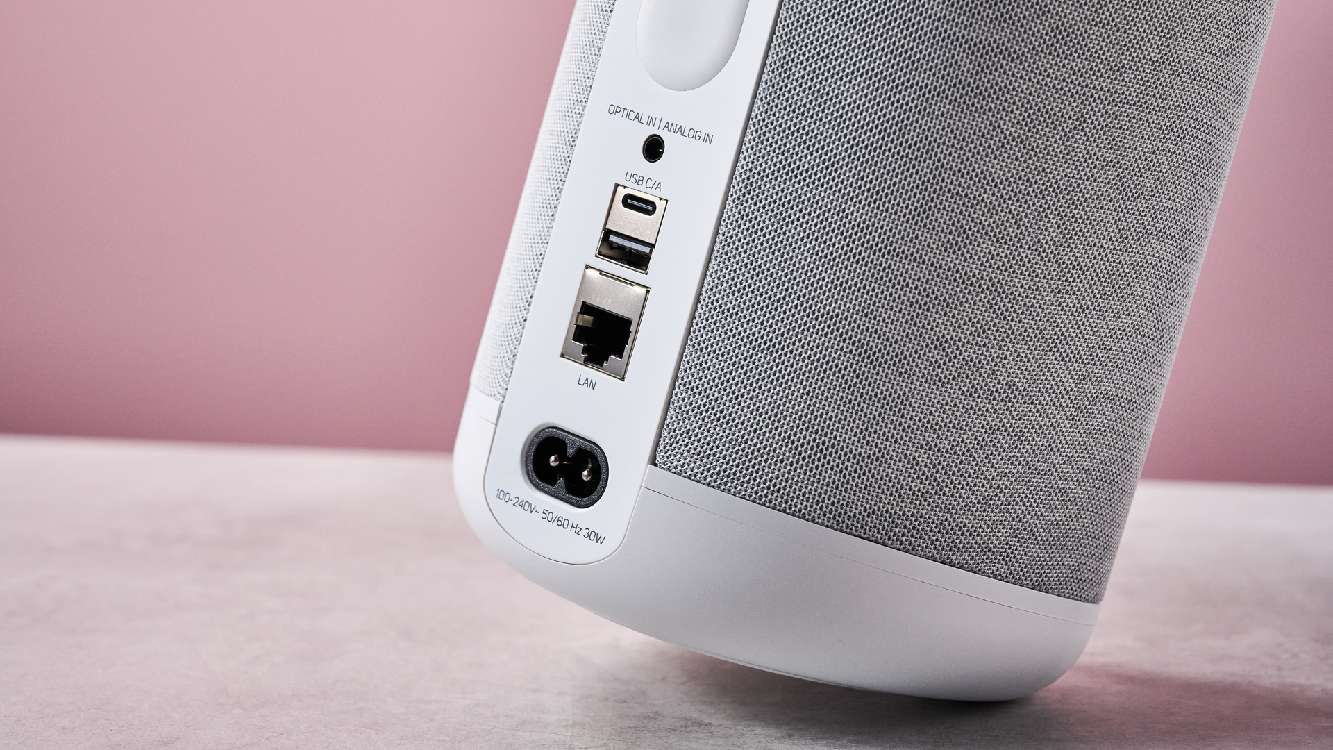 The Bluesound Pulse Flex from behind tipped up at an angle so you can see its ports.