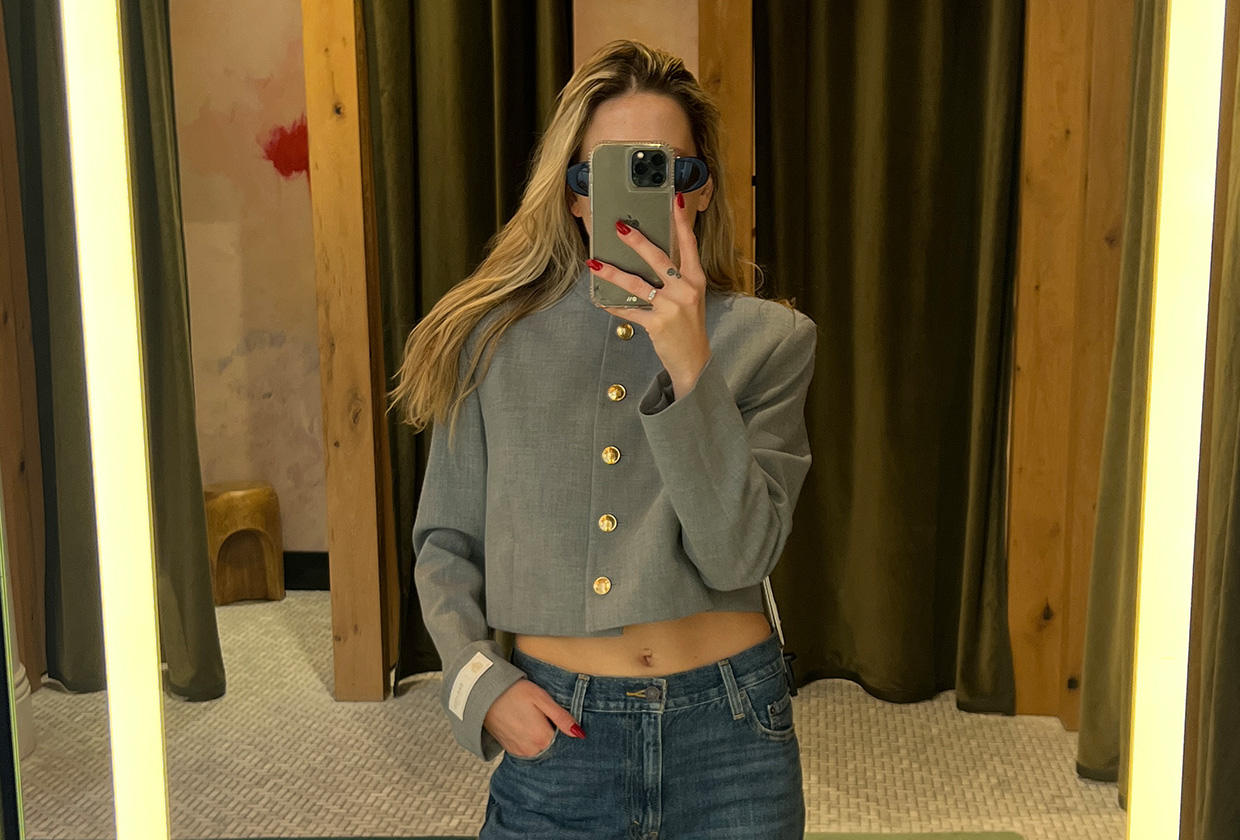 Eliza Huber wearing a gray cropped jacket and Levi's jeans from Aritzia