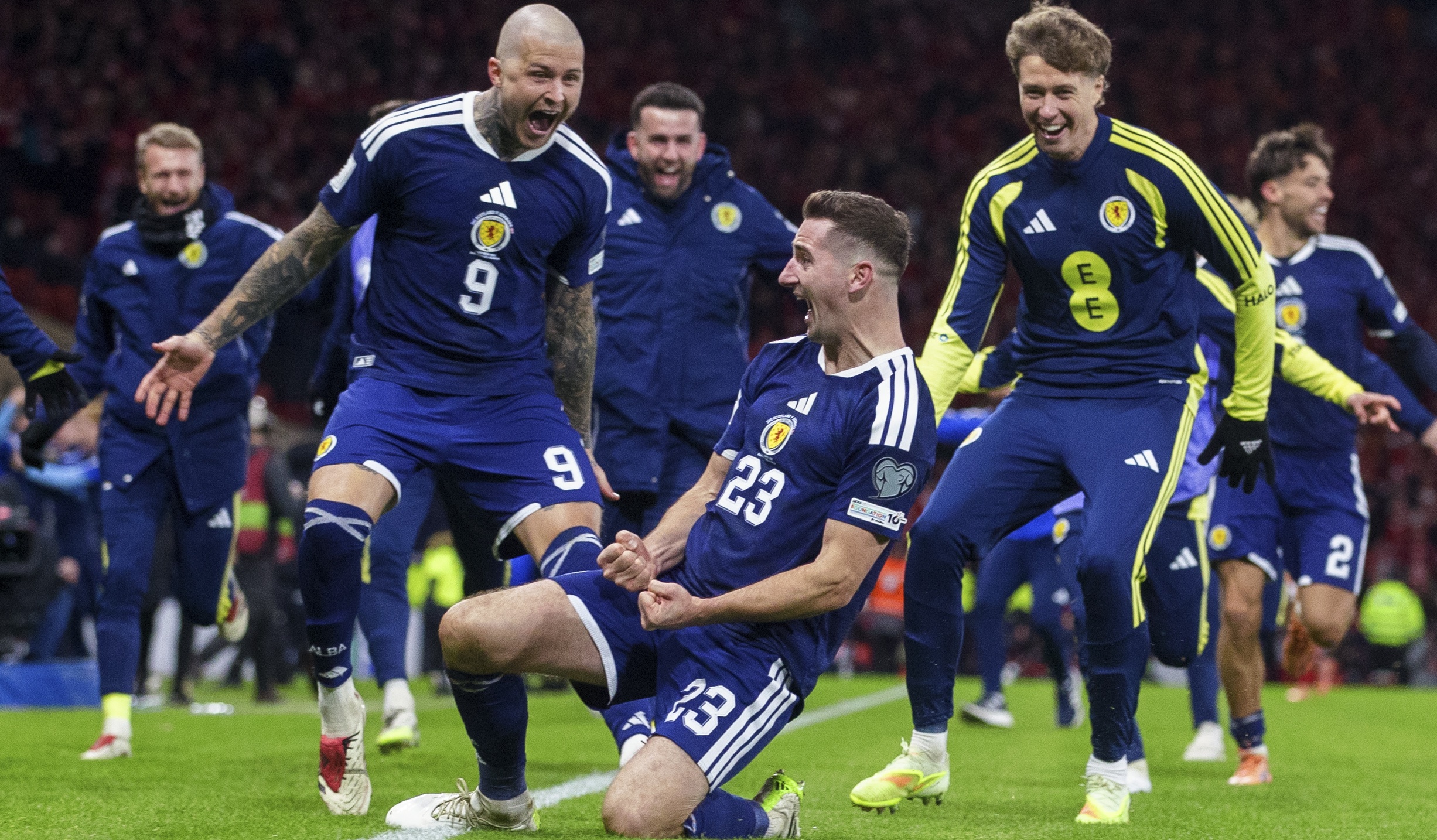 The Scotland team celebrate Kenny McLean's (centre) goal to make it 4-2 during a FIFA World Cup 2026 Qualifier between Scotland and Denmark at Hampden Park