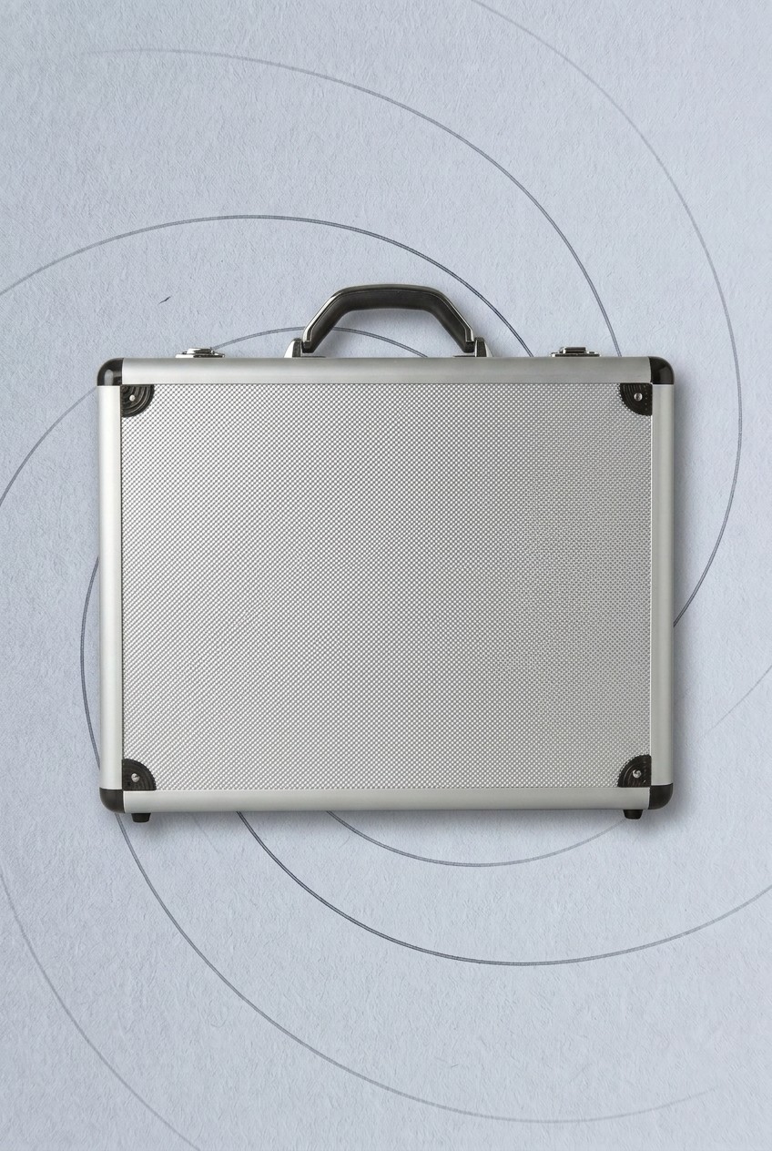James Bond home office gear on a gunmetal background