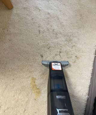 Black+Decker 12V MAX Dustbuster vacuuming dirty carpet