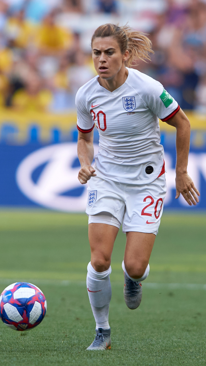 Karen Carney playing football for England