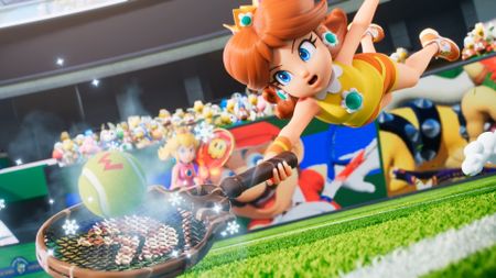 Daisy dives for the ball in the opening move for Mario Tennis Fever