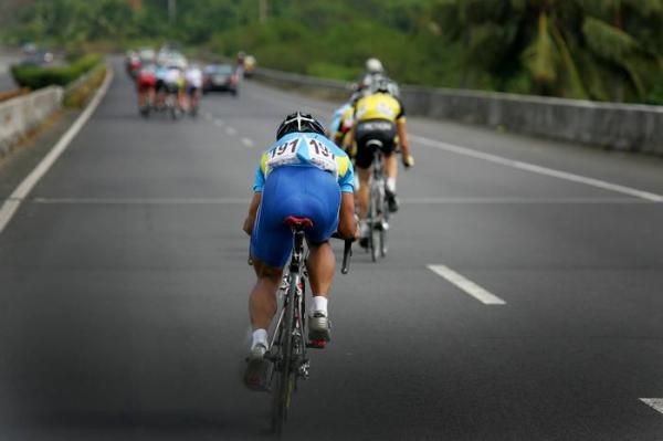 Ma Haijun (China) working hard to catch a small break up the road.