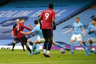 Manchester United’s Luke Shaw (left) scores their side’s second goal of the game during the Premier League match at the Etihad Stadium, Manchester. Picture date: Sunday March 7, 2021