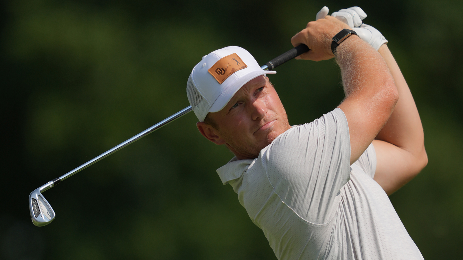 Brad Dalke hits an iron shot