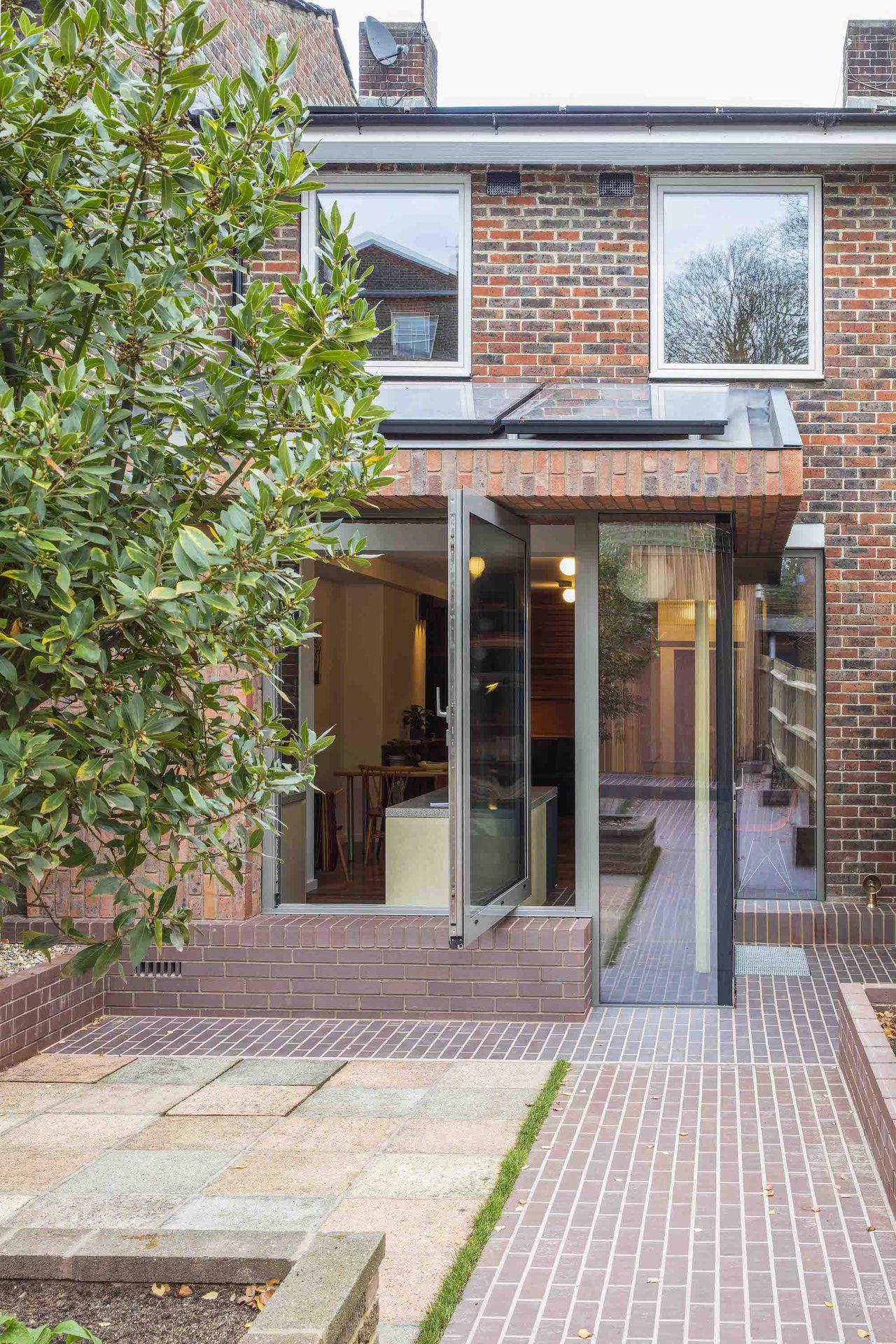 exterior of brick clad extension with large glass doors
