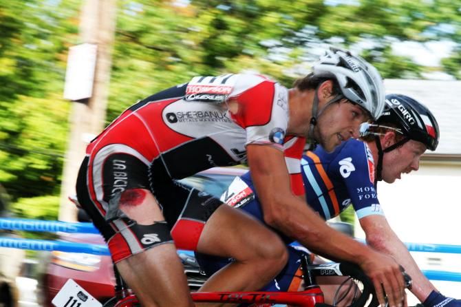 Anton Varabel (Jet Fuel Coffee-Norco Bicycle) riders through the pain of a tumble