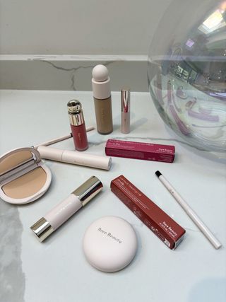 Still life of Rare Beauty products