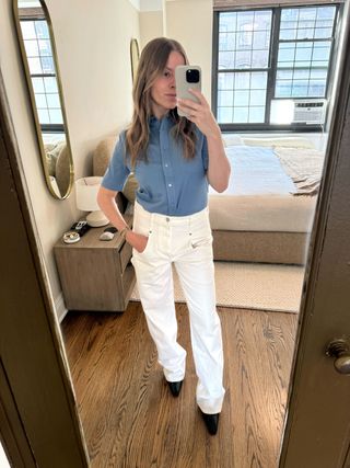 Fashion editor Nikki Chwatt in white jeans and blue shirt.