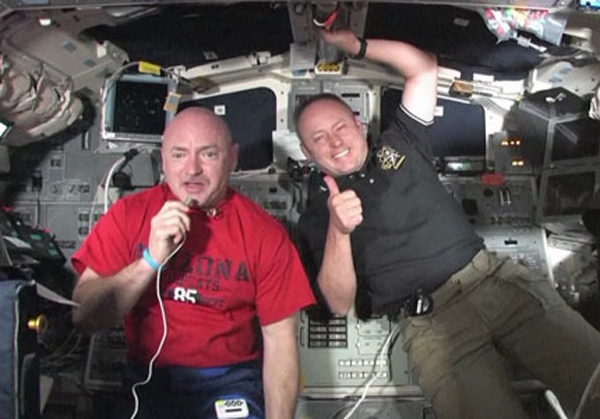 Endeavour space shuttle commander Mark Kelly (left) and Mission Specialist Mike Fincke aboard space shuttle Endeavour talk to students at Mesa Verde Elementary School in Tucson, Ariz., on May 22, 2011.