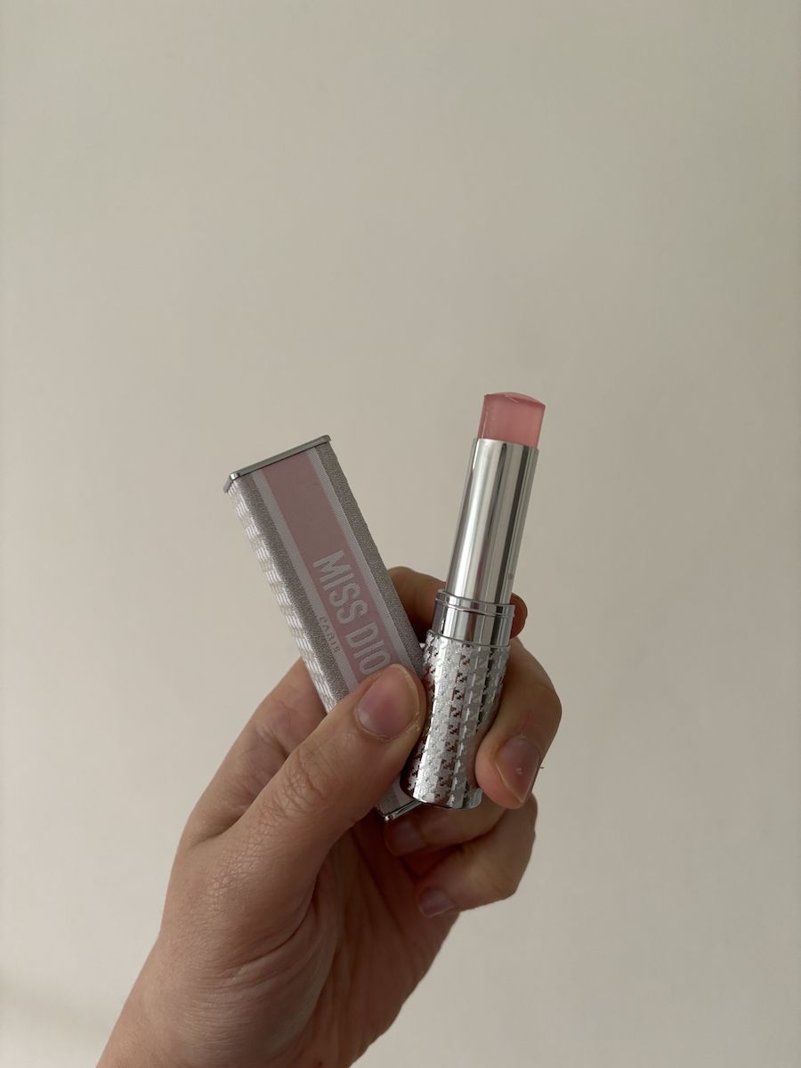 Mica Ricketts holding Dior Miss Dior Eau De Parfum Mini Miss Solid Perfume