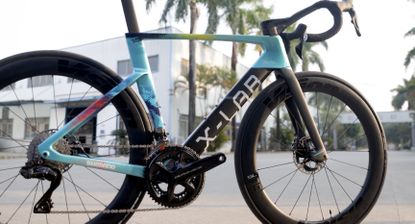 XDS Factory, raw carbon frame being assembled by workers