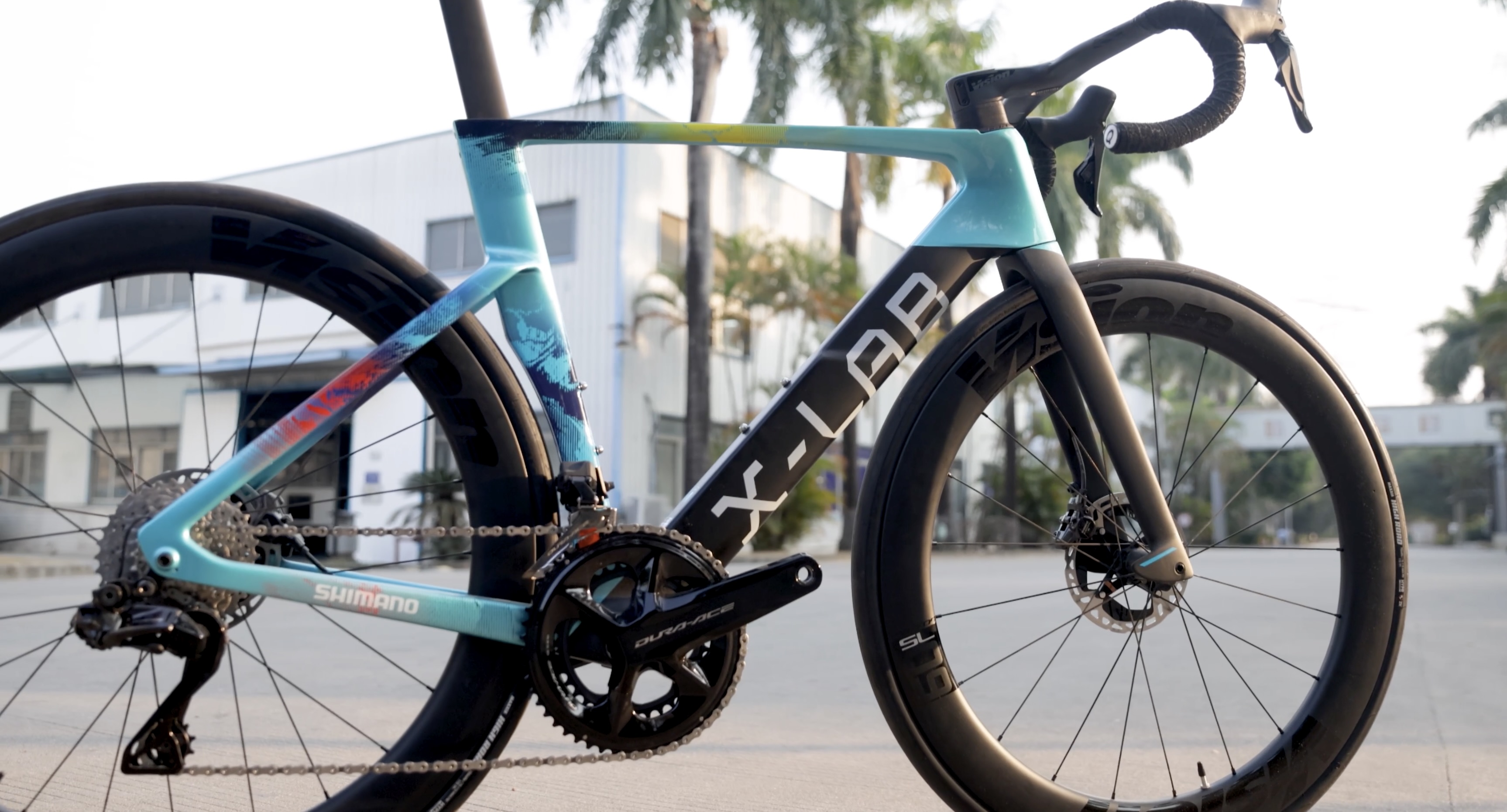 XDS Factory, raw carbon frame being assembled by workers