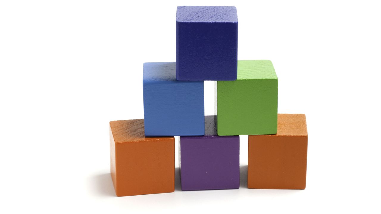 Six square children&#039;s blocks form a pyramid.