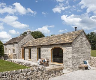 stone clad oak frame extension added to stone cottage