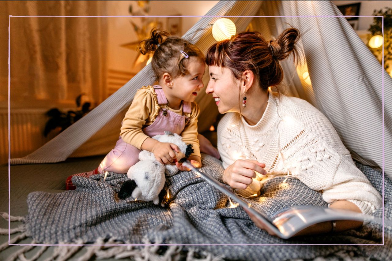 A woman reading a book to a young girl