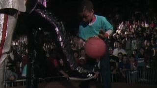 Ted DiBiase kicks a kid's basketball