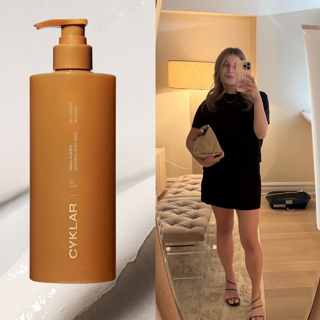 samantha holender in a black outfit taking a mirror selfie next to a bottle of cyklar lotion