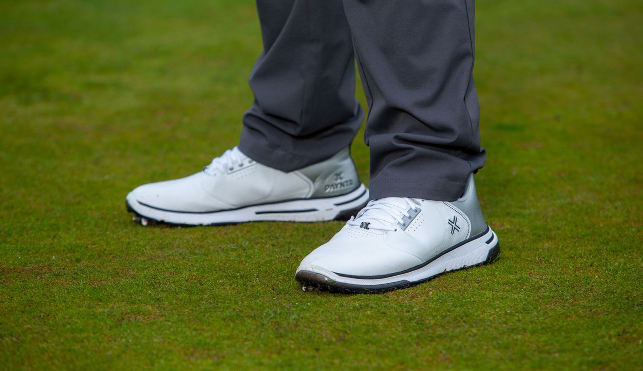 The Payntr X-006 Golf Shoes on a green background