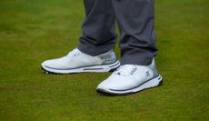 The Payntr X-006 Golf Shoes on a green background