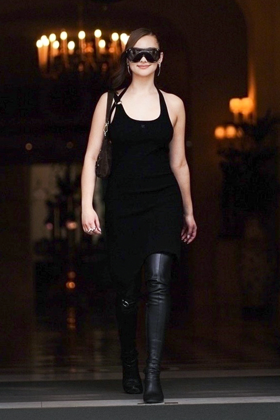Lola Tung was spotted in Paris wearing an anti-Belly little black dress and leather legging boots
