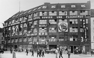 Karl-Liebknecht-Haus, the KPD's headquarters from 1926 to 1933. The Antifaschistische Aktion (a.k.a. "Antifa") logo can be seen prominently displayed on the front of the building.
