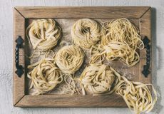 Homemade tagliatelle recipe served on a tray