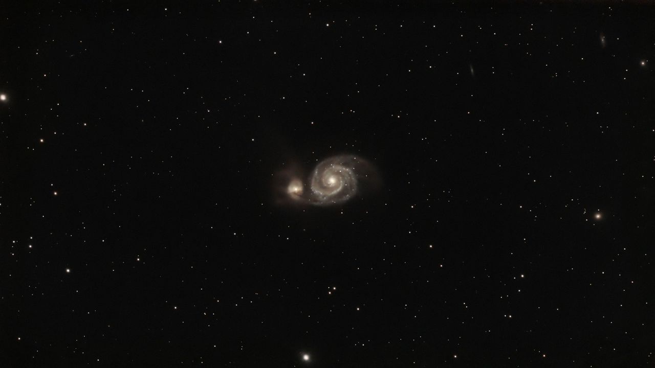 swirls of gas on a starry background