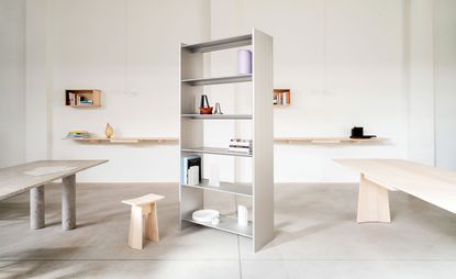 Bookcase in the middle of white room