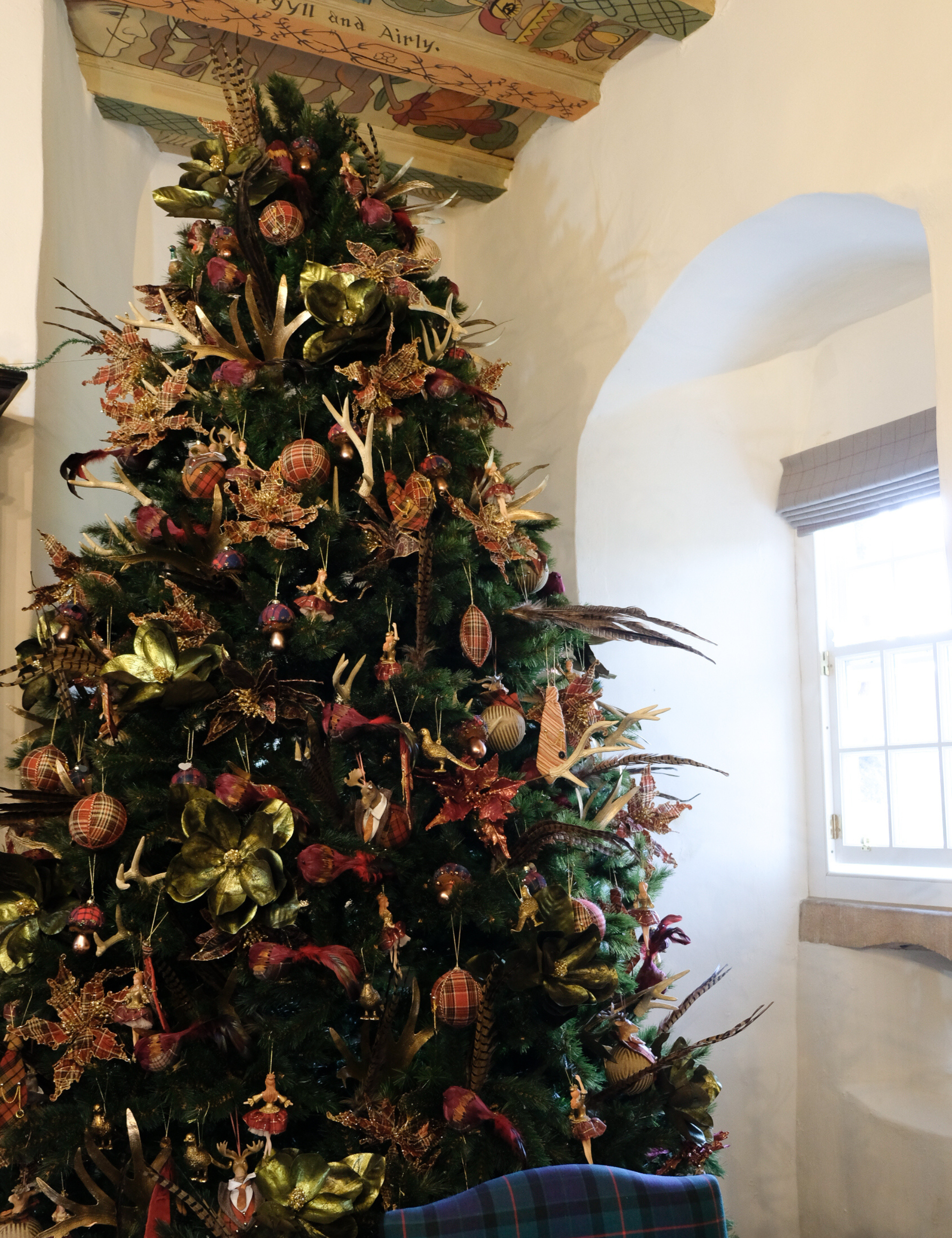 Christmas tree decorated with personal touches such as ballerinas and heirloom textiles