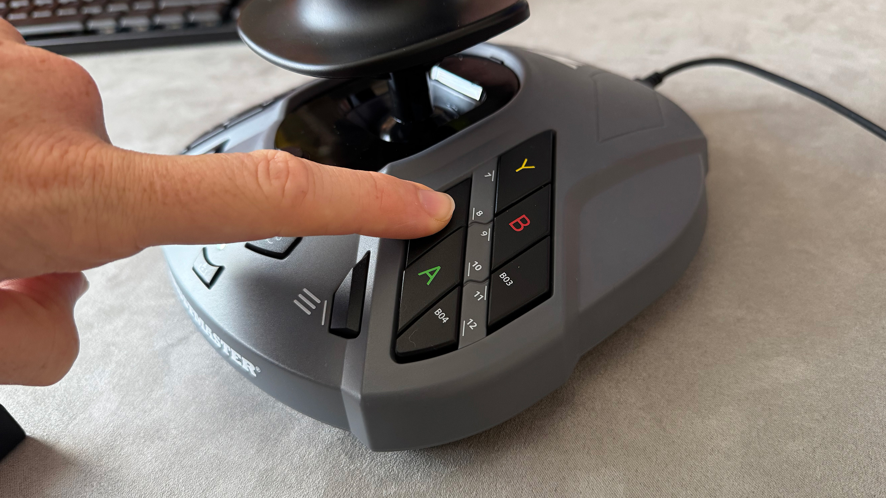 The Thrustmaster SimTask Farmstick on a desk